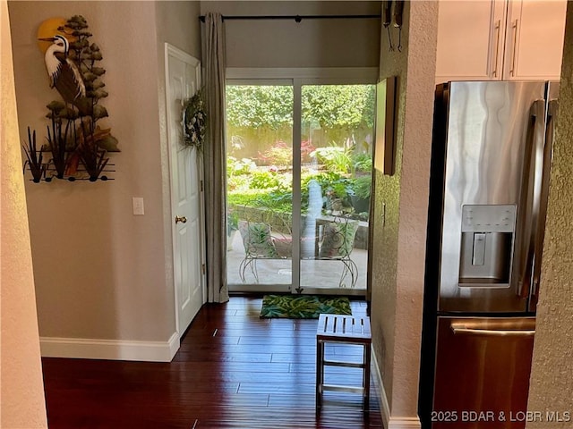 757 Malibu Rd Unit 101B, Osage Beach, MO 65065 - doorway with dark wood finished floors and a textured wall