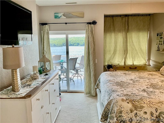 757 Malibu Rd Unit 101B, Osage Beach, MO 65065 - bedroom featuring access to outside and light colored carpet