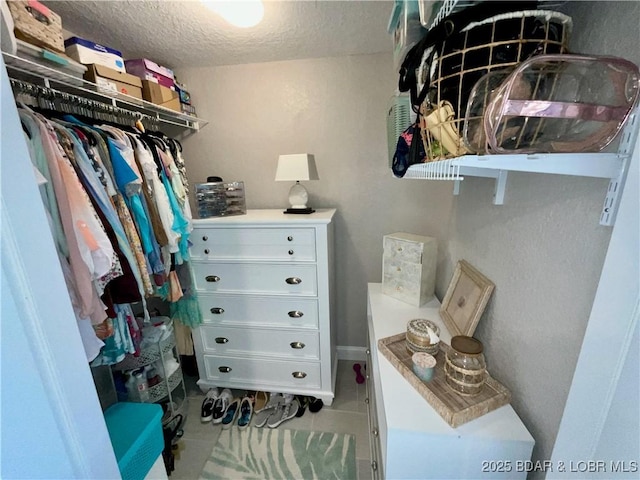 757 Malibu Rd Unit 101B, Osage Beach, MO 65065 - walk in closet featuring tile patterned floors