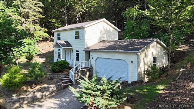 2096 Birchwood Ln, Osage Beach, MO 65065 - view of front of home with roof with shingles and an attached garage