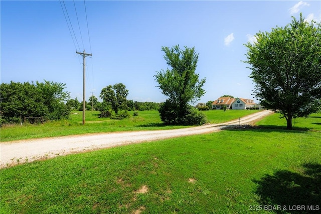 2174 State Road V, Linn Creek, MO 65052 - surrounding community featuring a lawn and dirt driveway