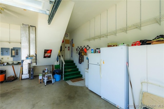 2174 State Road V, Linn Creek, MO 65052 - garage featuring freestanding refrigerator and electric panel