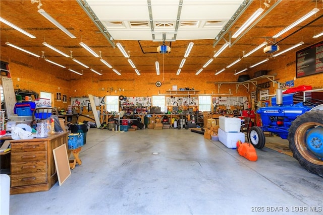 2174 State Road V, Linn Creek, MO 65052 - garage featuring a workshop area and a garage door opener