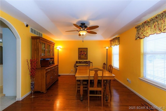 2174 State Road V, Linn Creek, MO 65052 - dining room with ceiling fan, arched walkways, and wood finished floors