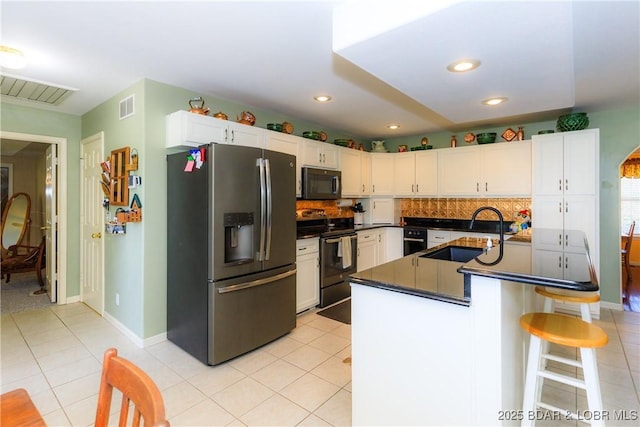 2174 State Road V, Linn Creek, MO 65052 - kitchen with stainless steel refrigerator with ice dispenser, range with electric stovetop, black microwave, dark countertops, and backsplash
