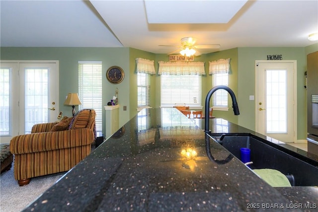 2174 State Road V, Linn Creek, MO 65052 - kitchen featuring ceiling fan and dark stone countertops