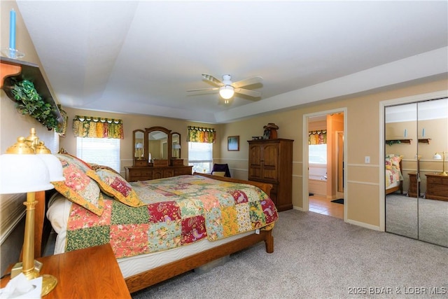 2174 State Road V, Linn Creek, MO 65052 - carpeted bedroom with multiple windows, ceiling fan, and connected bathroom