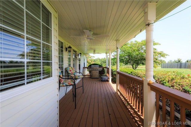 2174 State Road V, Linn Creek, MO 65052 - wooden porch with grilling area and a ceiling fan