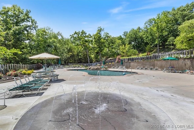 392 Hopetown Dr, Osage Beach, MO 65065 - community pool with a patio area and view of wooded area