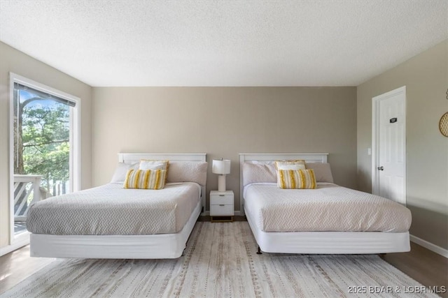 392 Hopetown Dr, Osage Beach, MO 65065 - bedroom with a textured ceiling