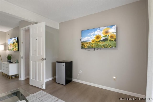 392 Hopetown Dr, Osage Beach, MO 65065 - unfurnished bedroom featuring refrigerator and wood finished floors