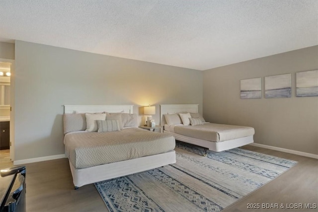 392 Hopetown Dr, Osage Beach, MO 65065 - bedroom featuring wood finished floors and a textured ceiling