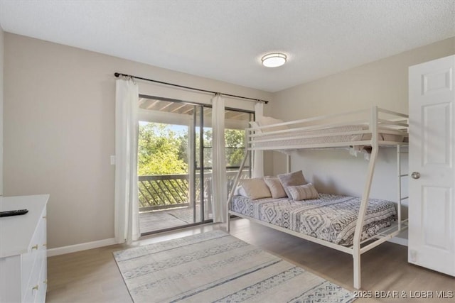 392 Hopetown Dr, Osage Beach, MO 65065 - bedroom with access to exterior and light wood-type flooring