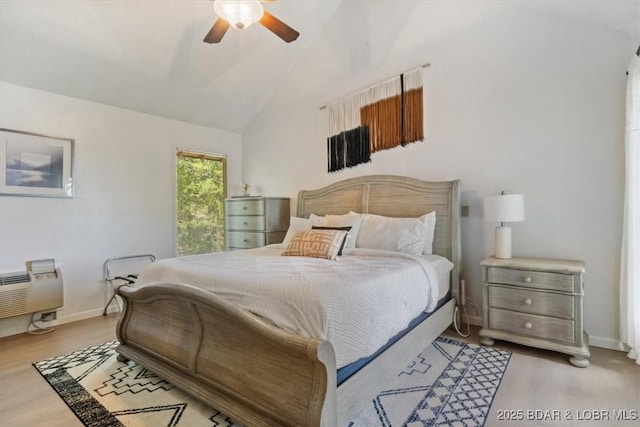 392 Hopetown Dr, Osage Beach, MO 65065 - bedroom featuring wood finished floors, ceiling fan, and high vaulted ceiling