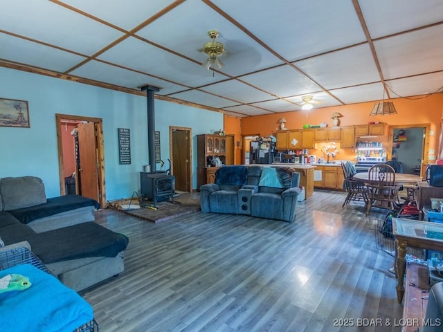 1727 Bollinger Creek Rd, Climax Springs, MO 65324 - living area with wood finished floors and a wood stove