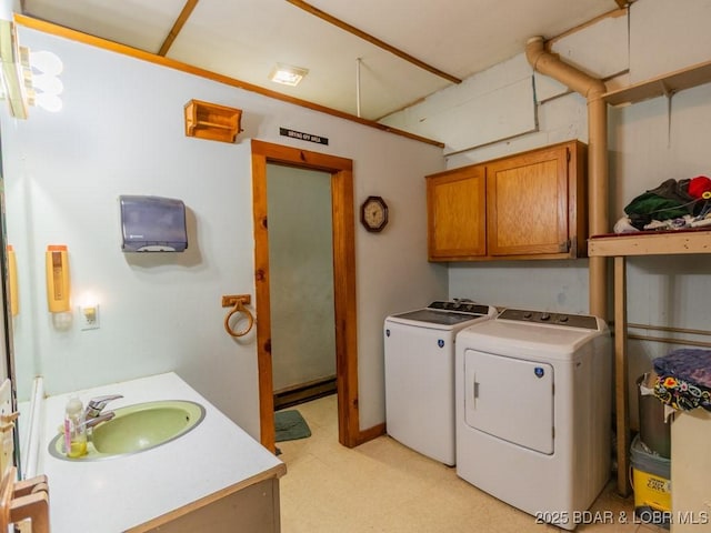 1727 Bollinger Creek Rd, Climax Springs, MO 65324 - laundry room featuring independent washer and dryer, a baseboard radiator, light flooring, and cabinet space