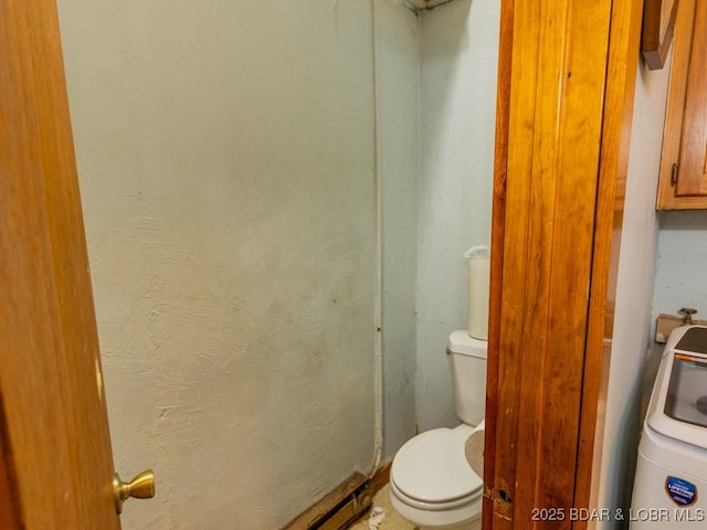 1727 Bollinger Creek Rd, Climax Springs, MO 65324 - bathroom with washer / dryer and toilet