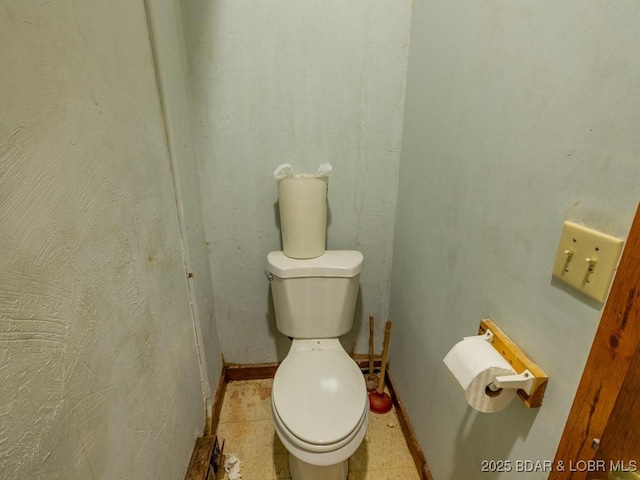 1727 Bollinger Creek Rd, Climax Springs, MO 65324 - bathroom featuring toilet and baseboards
