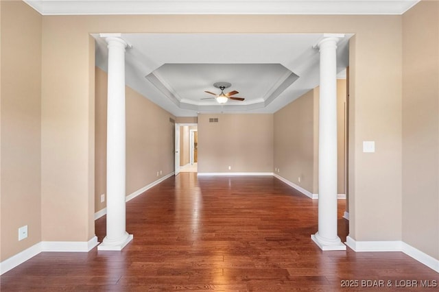22 Hand Ln, Eldon, MO 65026 - empty room featuring ceiling fan, a tray ceiling, hardwood / wood-style floors, ornate columns, and ornamental molding
