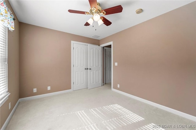 22 Hand Ln, Eldon, MO 65026 - unfurnished bedroom featuring light carpet, a closet, and ceiling fan
