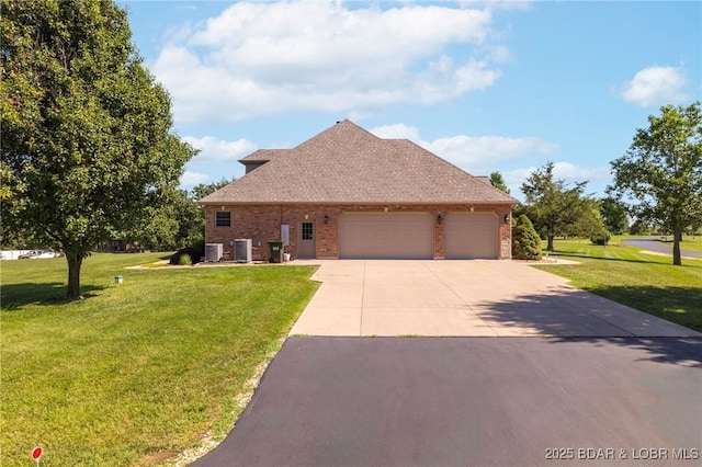22 Hand Ln, Eldon, MO 65026 - view of front facade featuring brick siding, concrete driveway, a garage, and a front yard