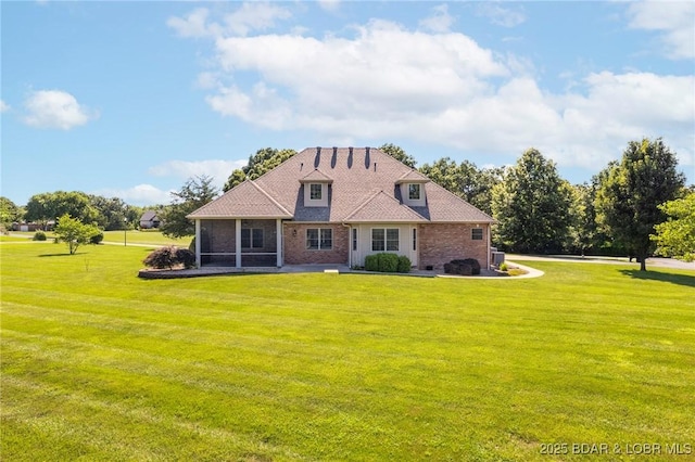 22 Hand Ln, Eldon, MO 65026 - back of house with brick siding, a lawn, and a sunroom