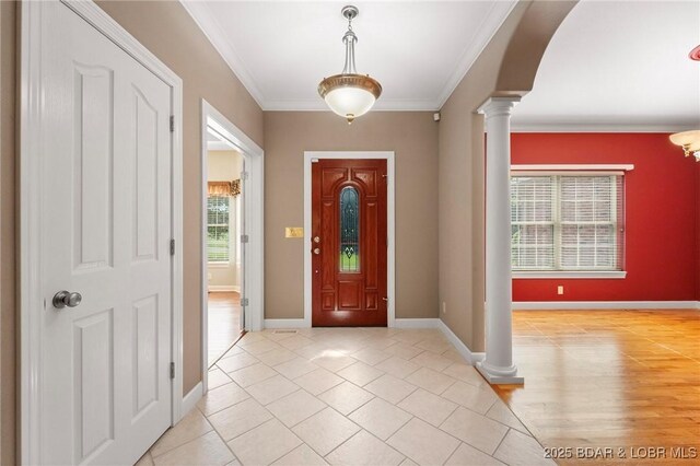 22 Hand Ln, Eldon, MO 65026 - entrance foyer featuring ornate columns, ornamental molding, and light tile patterned floors