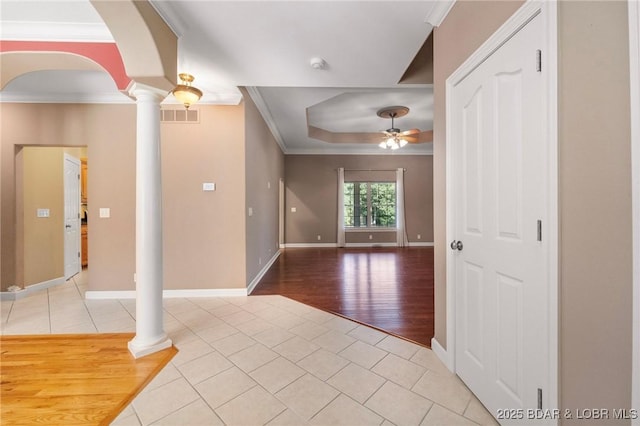 22 Hand Ln, Eldon, MO 65026 - entryway featuring ornate columns, ceiling fan, light tile patterned floors, arched walkways, and ornamental molding