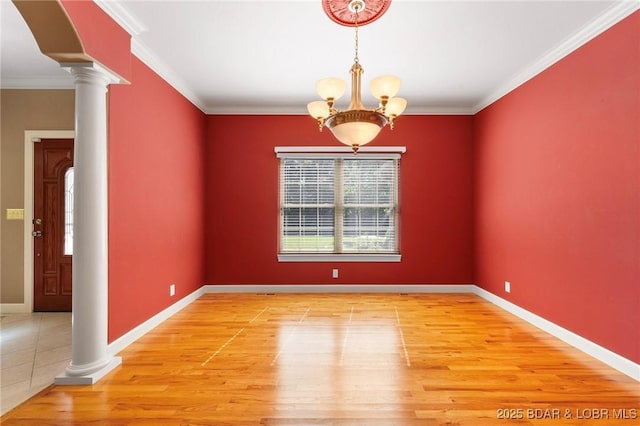 22 Hand Ln, Eldon, MO 65026 - unfurnished room featuring ornate columns, wood finished floors, a chandelier, and crown molding