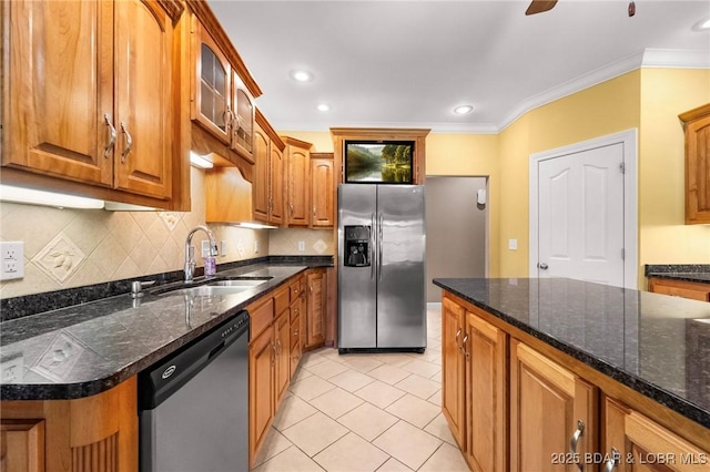 22 Hand Ln, Eldon, MO 65026 - kitchen with stainless steel appliances, light tile patterned floors, brown cabinets, tasteful backsplash, and glass insert cabinets