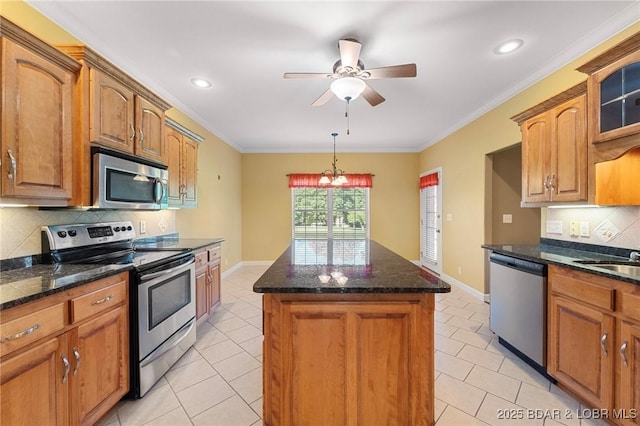 22 Hand Ln, Eldon, MO 65026 - kitchen featuring stainless steel appliances, a kitchen island, light tile patterned floors, backsplash, and a ceiling fan