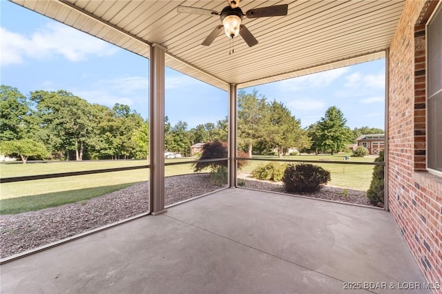 22 Hand Ln, Eldon, MO 65026 - unfurnished sunroom with ceiling fan and view of scattered trees