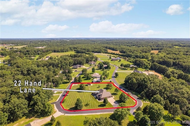 22 Hand Ln, Eldon, MO 65026 - aerial view of property and surrounding area featuring a forest and property parcel outlined