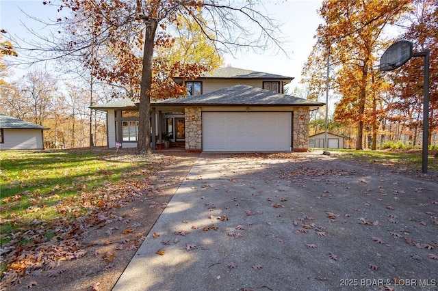 170 Twin Oaks Dr, Lake Ozark, MO 65049 - view of front of house with stone siding, driveway, and an attached garage