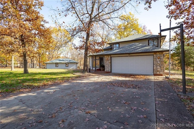 170 Twin Oaks Dr, Lake Ozark, MO 65049 - view of front of property featuring stone siding, concrete driveway, an attached garage, and a front lawn