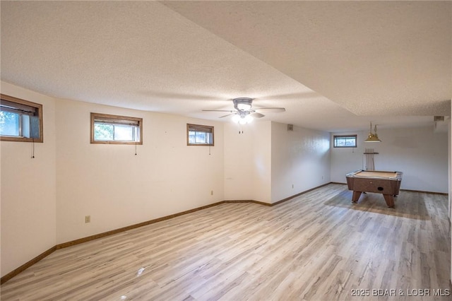 170 Twin Oaks Dr, Lake Ozark, MO 65049 - basement with a textured ceiling, light wood finished floors, billiards table, and ceiling fan