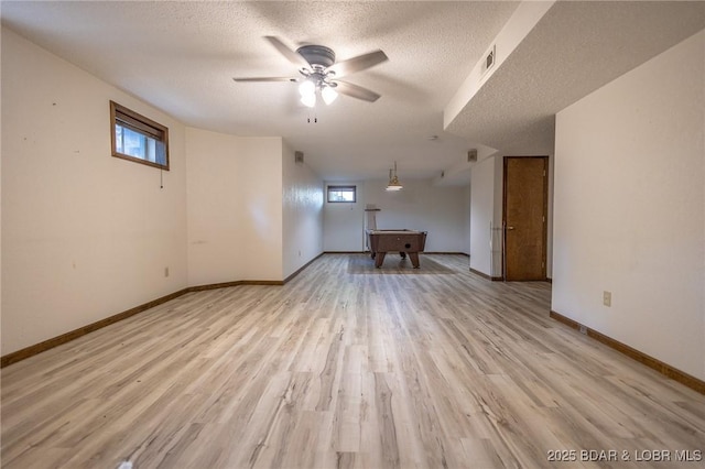 170 Twin Oaks Dr, Lake Ozark, MO 65049 - empty room with a ceiling fan, a textured ceiling, and light wood-style floors