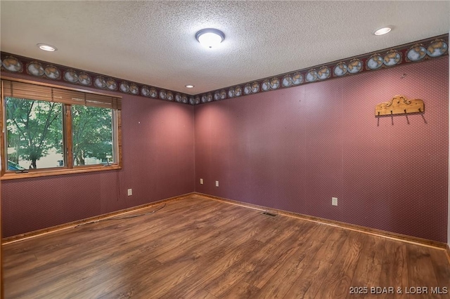 170 Twin Oaks Dr, Lake Ozark, MO 65049 - empty room with wood finished floors, a textured ceiling, and recessed lighting