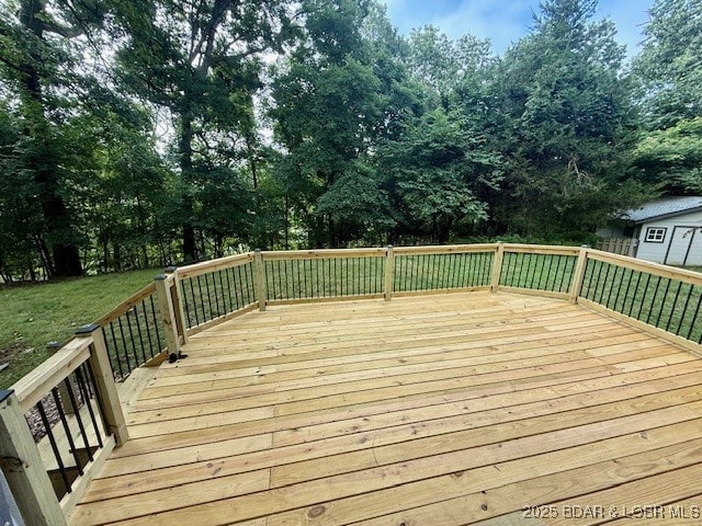 170 Twin Oaks Dr, Lake Ozark, MO 65049 - deck featuring a yard and view of wooded area