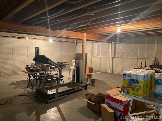 130 Guinevere Ct, Camdenton, MO 65020 - unfinished basement with brick wall