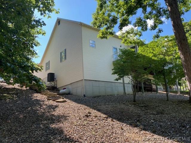130 Guinevere Ct, Camdenton, MO 65020 - view of property exterior featuring a central air condition unit