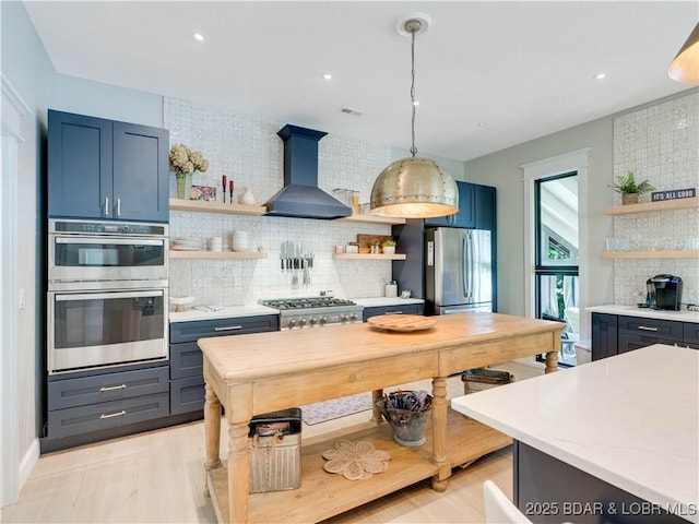 92 Arrowhead Beach Rd, Lake Ozark, MO 65049 - kitchen featuring open shelves, wall chimney range hood, stainless steel appliances, decorative backsplash, and recessed lighting
