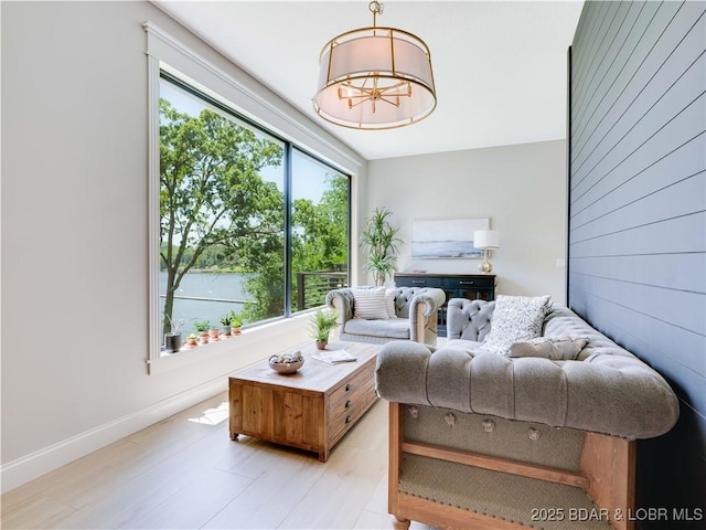 92 Arrowhead Beach Rd, Lake Ozark, MO 65049 - living room with a chandelier and light wood finished floors