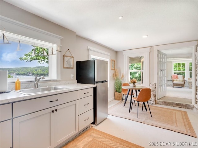92 Arrowhead Beach Rd, Lake Ozark, MO 65049 - kitchen featuring freestanding refrigerator, light countertops, and recessed lighting