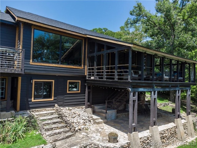 92 Arrowhead Beach Rd, Lake Ozark, MO 65049 - back of property featuring a patio area, a deck, and stairway