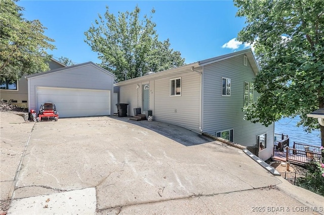 35 Port Bagnell W, Eldon, MO 65026 - view of front facade featuring an outbuilding and a detached garage