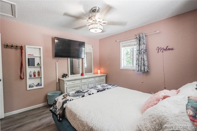 35 Port Bagnell W, Eldon, MO 65026 - bedroom with dark wood finished floors, a textured ceiling, and a ceiling fan