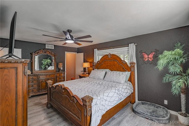 35 Port Bagnell W, Eldon, MO 65026 - bedroom featuring light wood-type flooring and a ceiling fan
