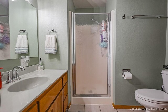 35 Port Bagnell W, Eldon, MO 65026 - bathroom with a stall shower, vanity, tile patterned flooring, and a textured wall