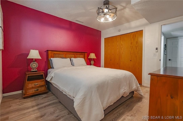 35 Port Bagnell W, Eldon, MO 65026 - bedroom featuring wood finished floors and a closet